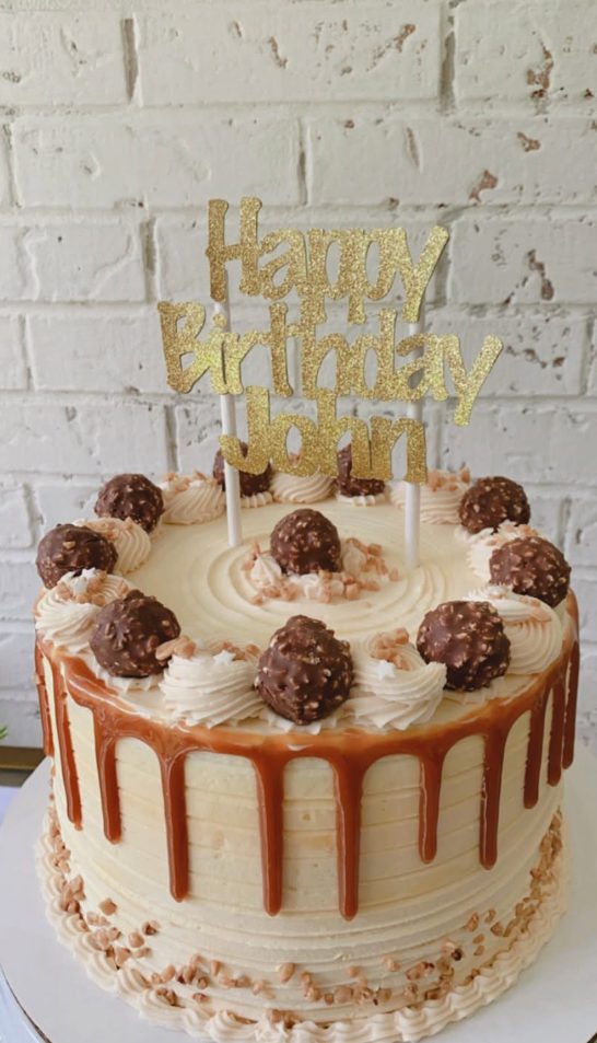 A tall caramel drip cake made by Tere in Long Beach, Mississippi
